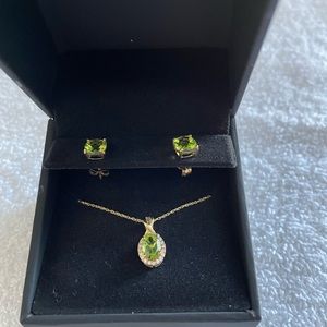 Oval Emerald 1/15 Ct. T.W. Diamond Frame Pendant in 10K Gold. 6mm Emerald stud.